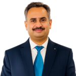 Mr. Shaukat Iqbal, Chemistry and Biology teacher in navy suit, studio portrait on white background